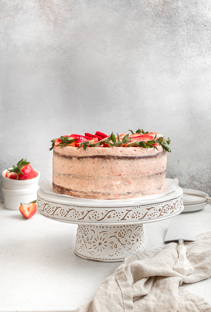 cake with strawberries and cream cheese frosting