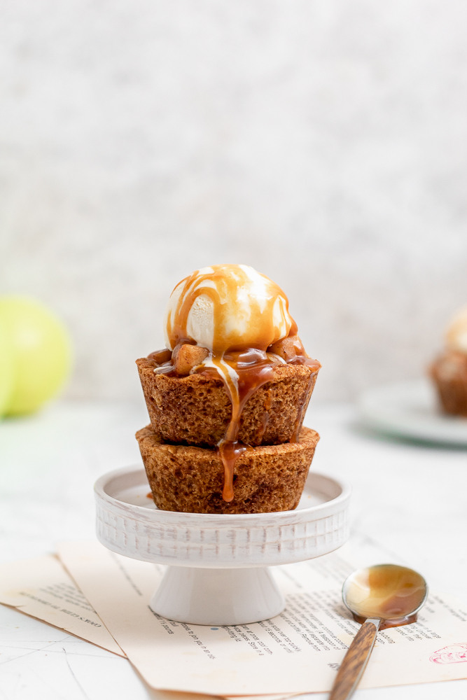 stacked cookie cups with caramel dripping down the sides 