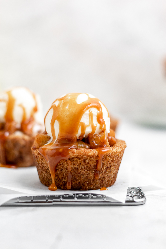 Apple pie cookie cups with vanilla ice cream and caramel drizzle