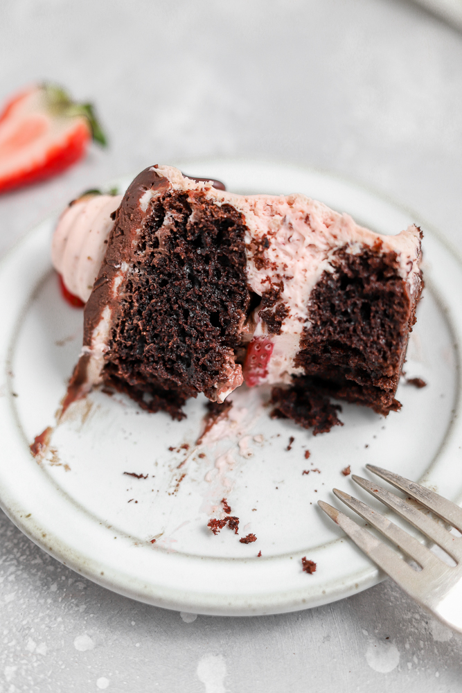 slice of chocolate cake with strawberry frosting
