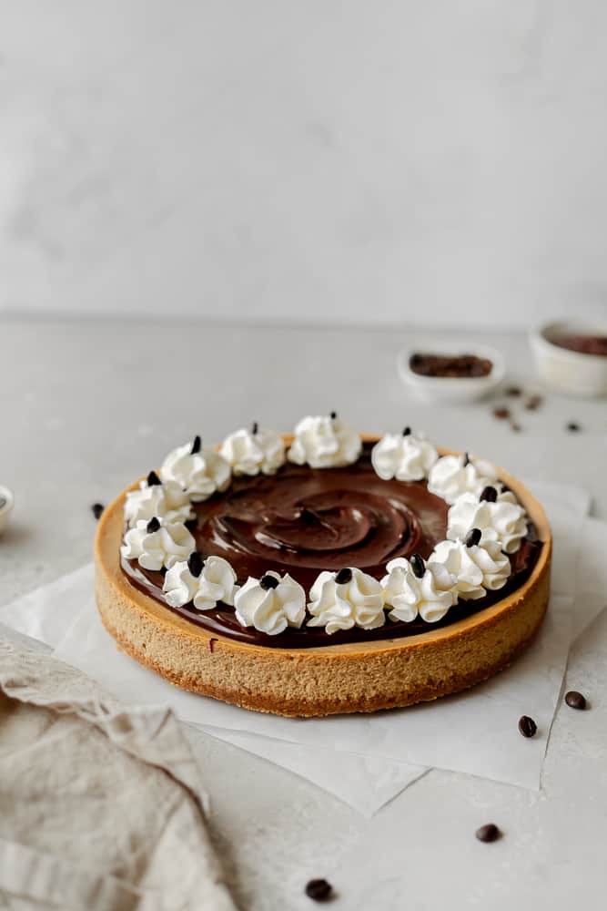 coffee cheesecake with ganache and whipping cream