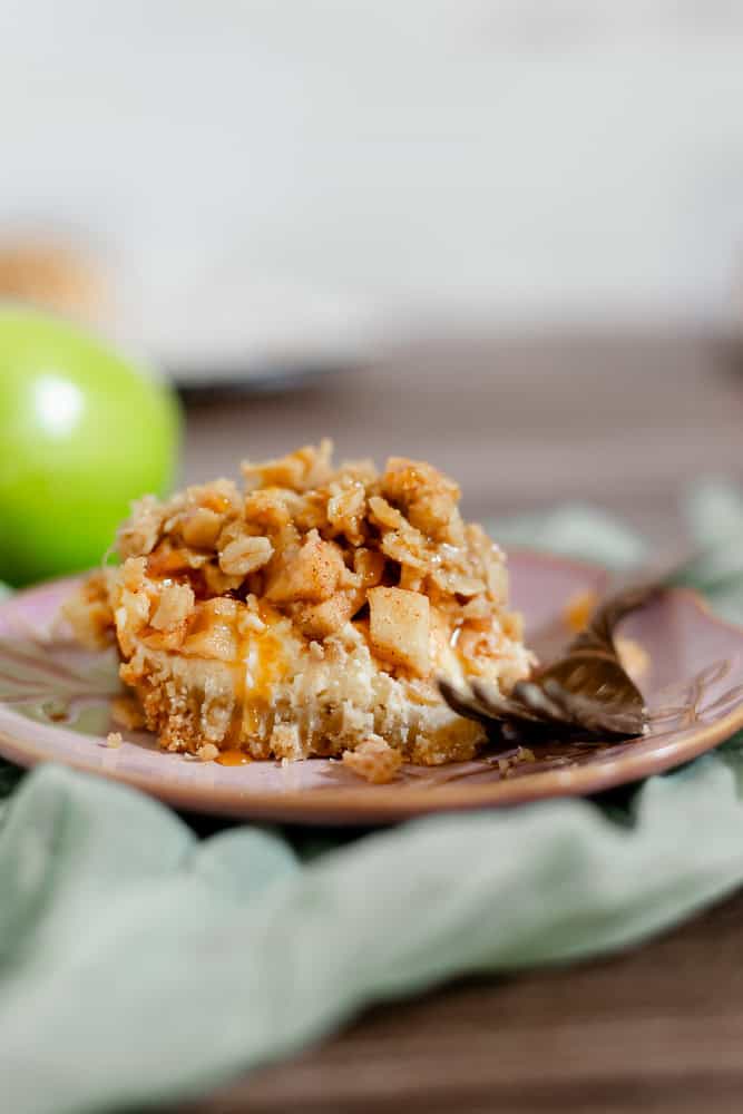 slice of apple crisp cheesecake bars